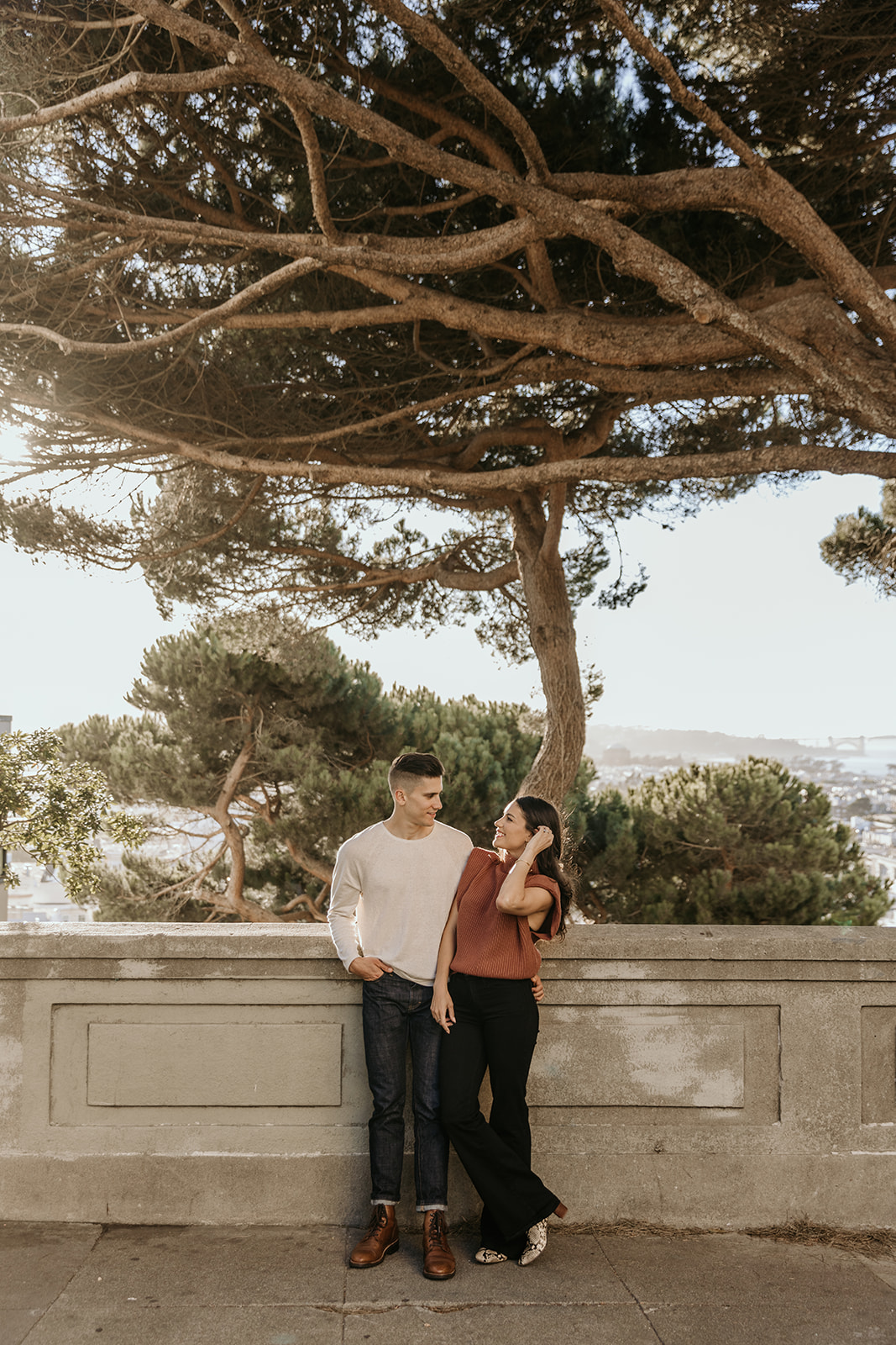 Couple posing by tree in russian hill san francisco
