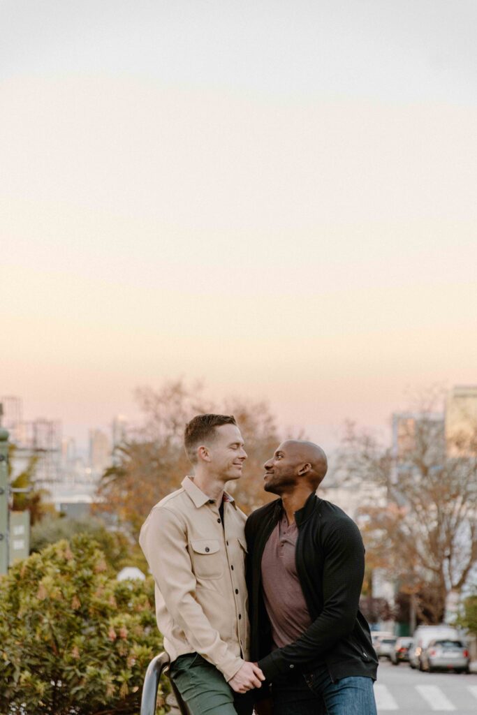 couple in front of sunset in san francisco